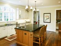 Left angle of Selkirk Drive's new kitchen with kitchen island and pendant lighting