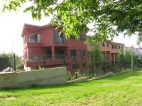 backyard architectural detail and landscaping to red urban villa