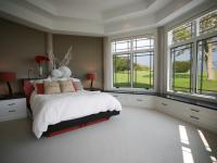 Carr project - nautical New England waterfront home - guest bedroom with picture windows