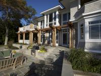 Carr project - nautical New England waterfront home - rear patio in sunlight