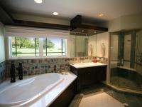 Carr project - nautical New England waterfront home - master bathroom with tub and water views