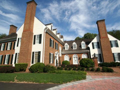 Stately brick entrance to project from Frank M Bell and Ballard + Mensua