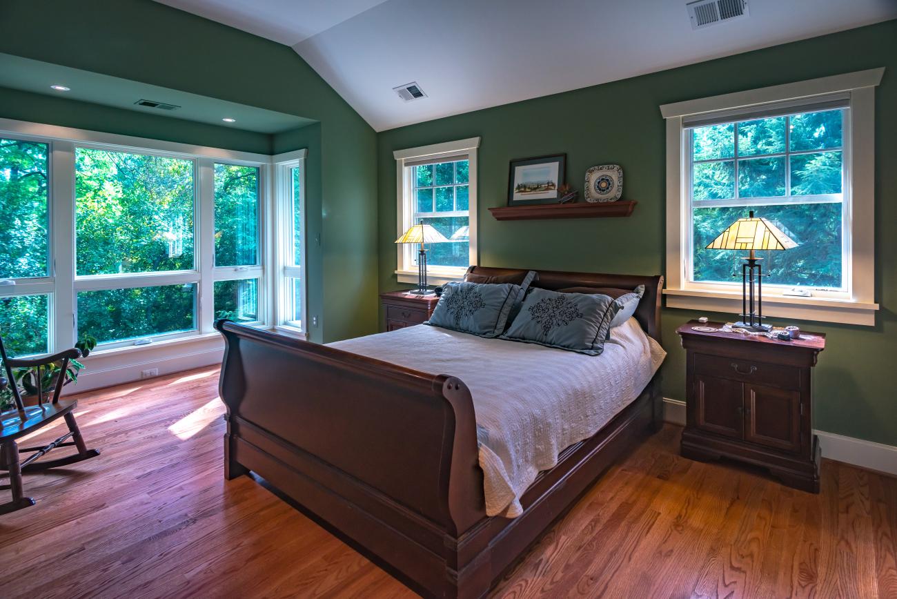 master bedroom with large windows - Two story renovation - Loucks project