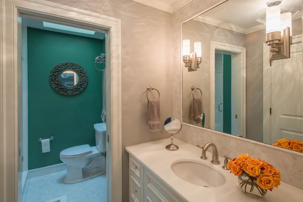 hall bathroom with toilet and shower