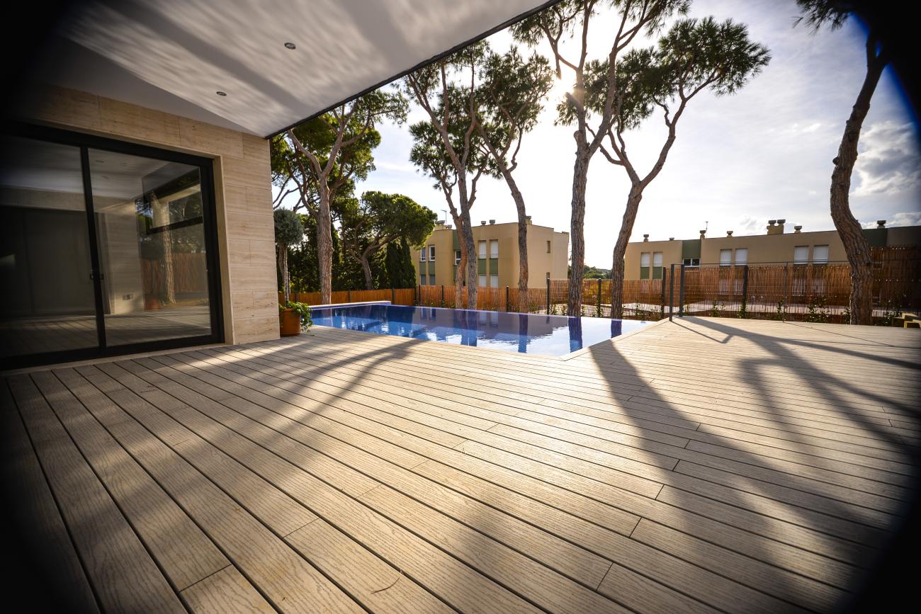 beautiful dark finished deck with backyard pool - Ballard & Mensua