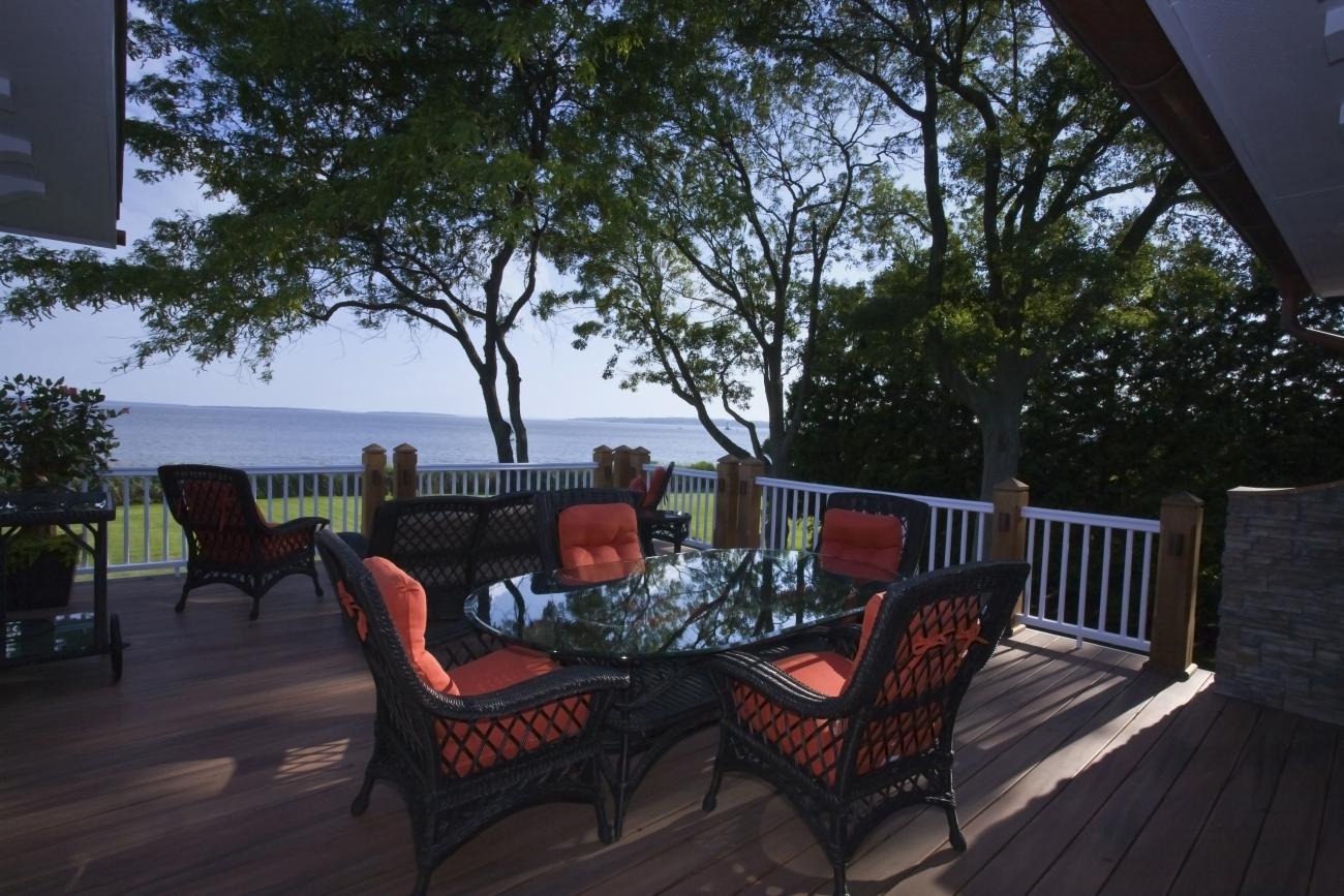Carr project - nautical New England waterfront home - terrace at sunset